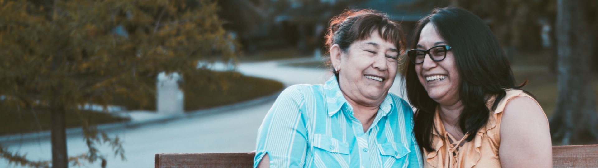 Hero image of two women laughing together