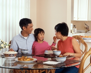 family of three having breakfast together