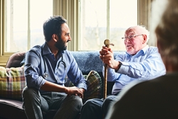 a yong man and an elder man sitting