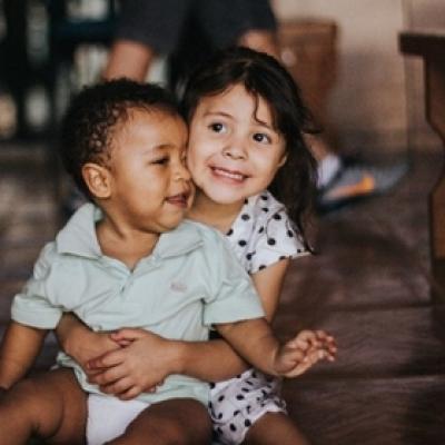 image of two children hugging